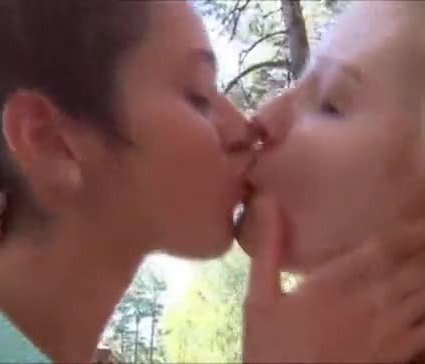Lesbian models kissing outside